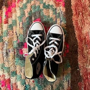 Brand new black classic Converse chuck high tops.